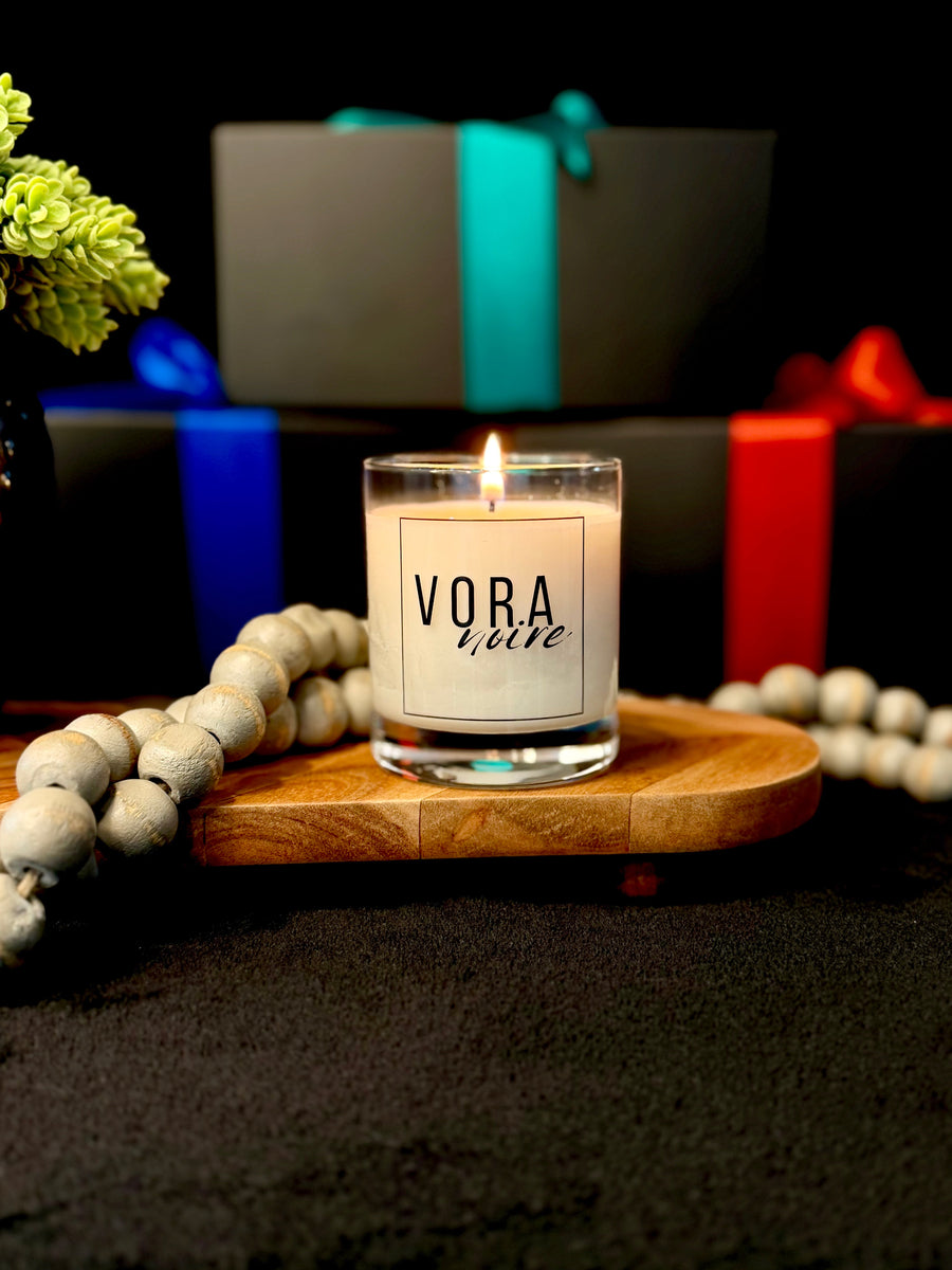 The candle, hand-poured in Tennessee, with the month's wrapped boxes